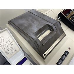 Four 1970s Sinclair electronic calculators - Cambridge in hard case with booklet; Scientific Programmable with Program Library and booklet; Scientific in hard case; and Oxford 300 in soft case with booklet; together with Texas PC-100 SR56 programmable slide-rule calculator on base station with readout, two booklets, keys and cover, serial no.9103093