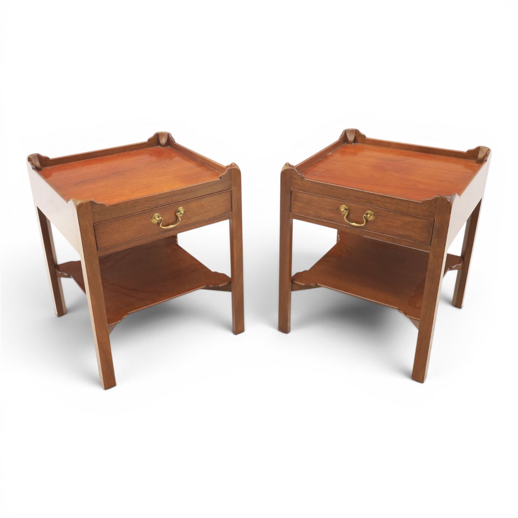 Georgian style pair of mahogany lamp tables, each with three-quarter gallery top above a single frieze drawer with brass swan neck handle, on square tapering supports united by an undertier