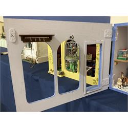 Three scratch-built wooden shop dioramas - single room Pet Shop with hinged front, fully furnished and well stocked with animals, birds and numerous accessories; and matching Garden Shop, fully furnished and well stocked with fruit, vegetables and garden accessories including lawn mower, wheelbarrows etc; each W34cm H27cm D26cm; and double fronted single room Butchers Shop with butcher at his block, partially stocked counter and two delivery cycles W57cm (3)