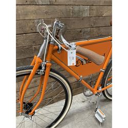 Fully restored vintage advertising bicycle with 2 stroke petrol engine, orange frame, tan leather seat