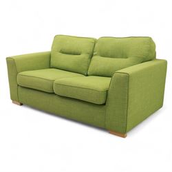 Contemporary lime green upholstered sofa bed, with rectangular arms and two seat cushions, the back with two stitched backrest cushions, on low block feet