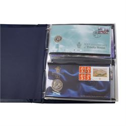 Approximately 104 Royal Mail Royal Mint coin or medallion covers, housed in an official Royal Mail Royal Mint ring binder folder and loose, together with The Queen's Golden Jubilee Coin Cover Collection in two albums, commemorative fifty pences, crowns, etc