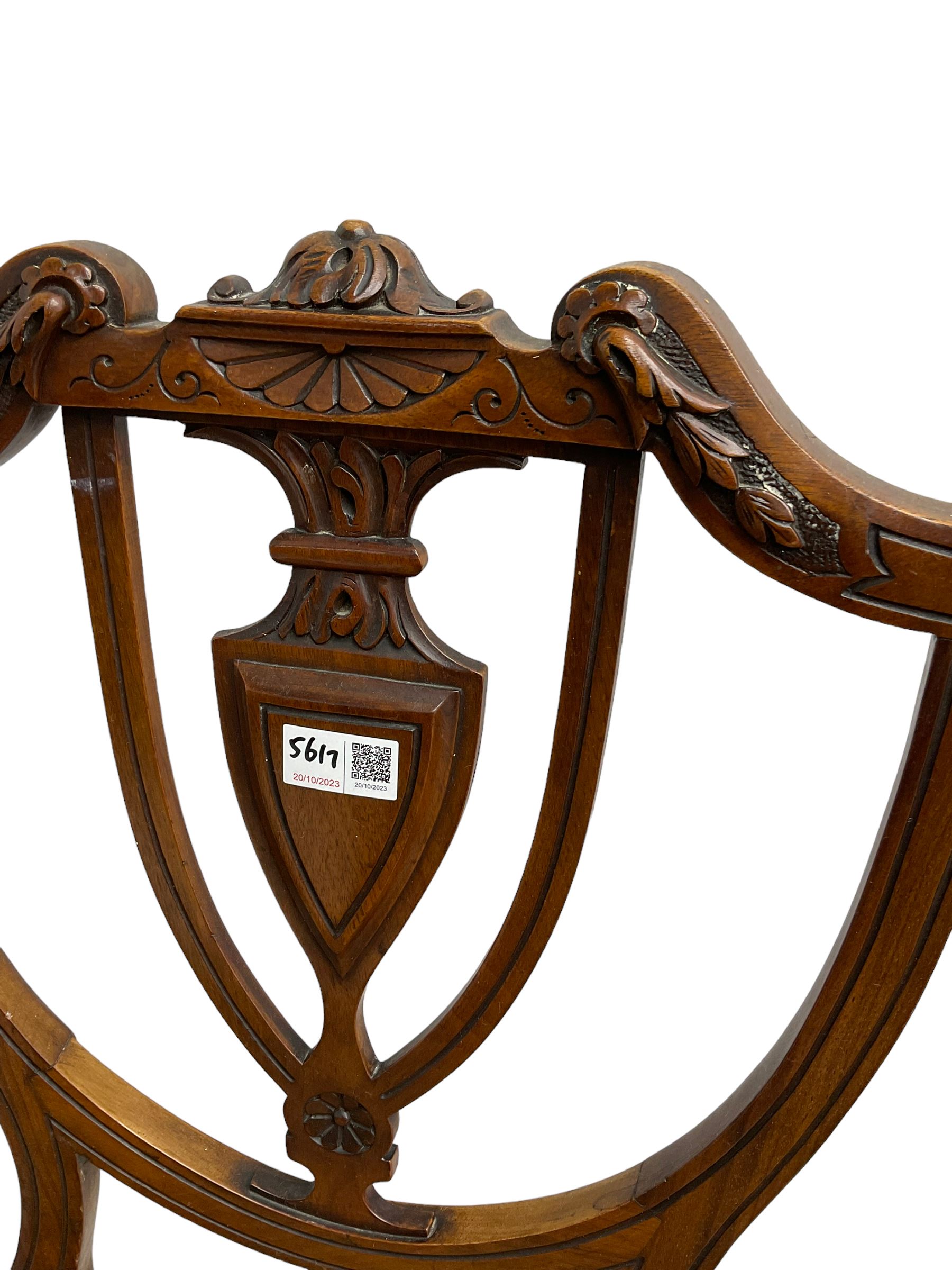 Pair of Regency rosewood framed side chairs, carved back rails over cane seat, raised on reeded supports (W46cm D50cm H84cm); set of three Edwardian walnut cane seat bedroom chairs, carved shield back (W41cm H88cm)