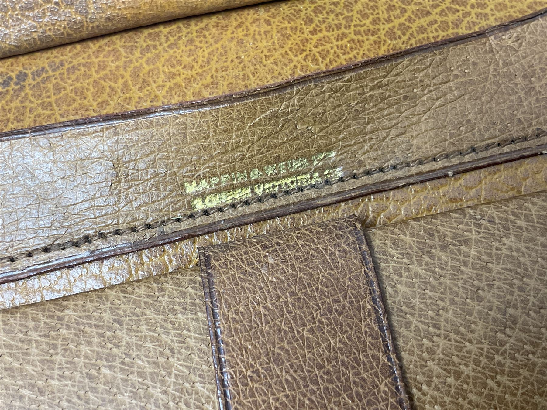 Mappin & Webb leather cased campaign gentleman's vanity set, the tan leather case opening to reveal fitted interior with five engine turned silver capped glass vanity bottles, hallmarked Mappin & Webb, London 1944, brushes, mirror etc, monogram DPK to the top of the case