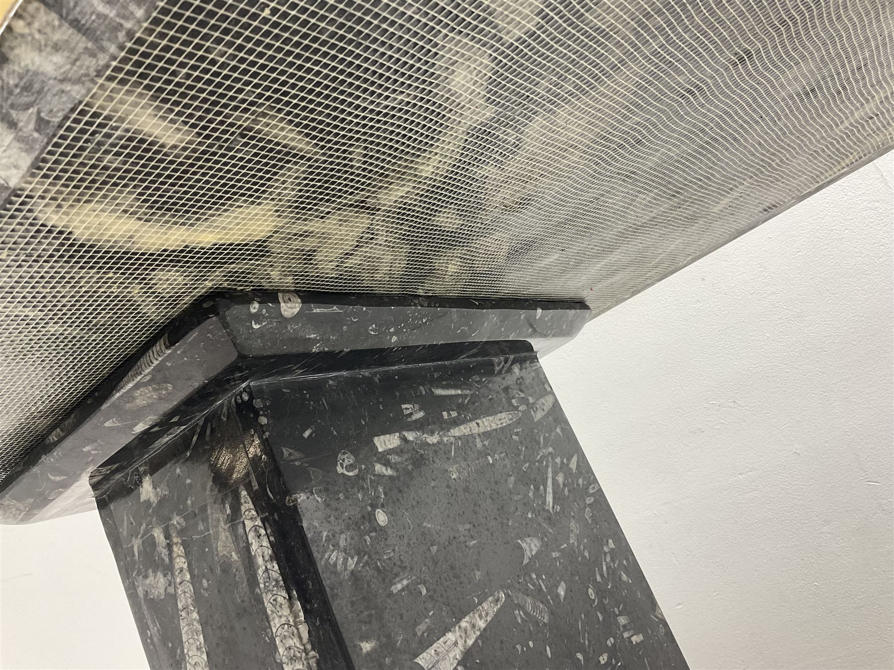 Marble hall table with orthoceras and goniatite inclusions, the rectangular top upon two rectangular stepped plinths, H75cm, L135cm, D78cm 