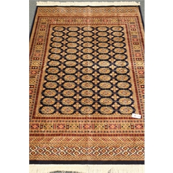 Bokhara blue ground rug, repeating elephant foot medallion field, 190cm x 135cm  