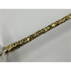 Pair of modern silver candlesticks by Stuart Devlin, the tapering parcel gilt stems with signature textured detailing, each supporting a fluted candle holder and upon a spreading circular foot, hallmarked Stuart Devlin, London 1973, H25cm