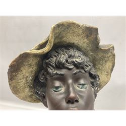 19th century plaster bust of a young boy wearing a hat, upon black painted socle base, H46cm