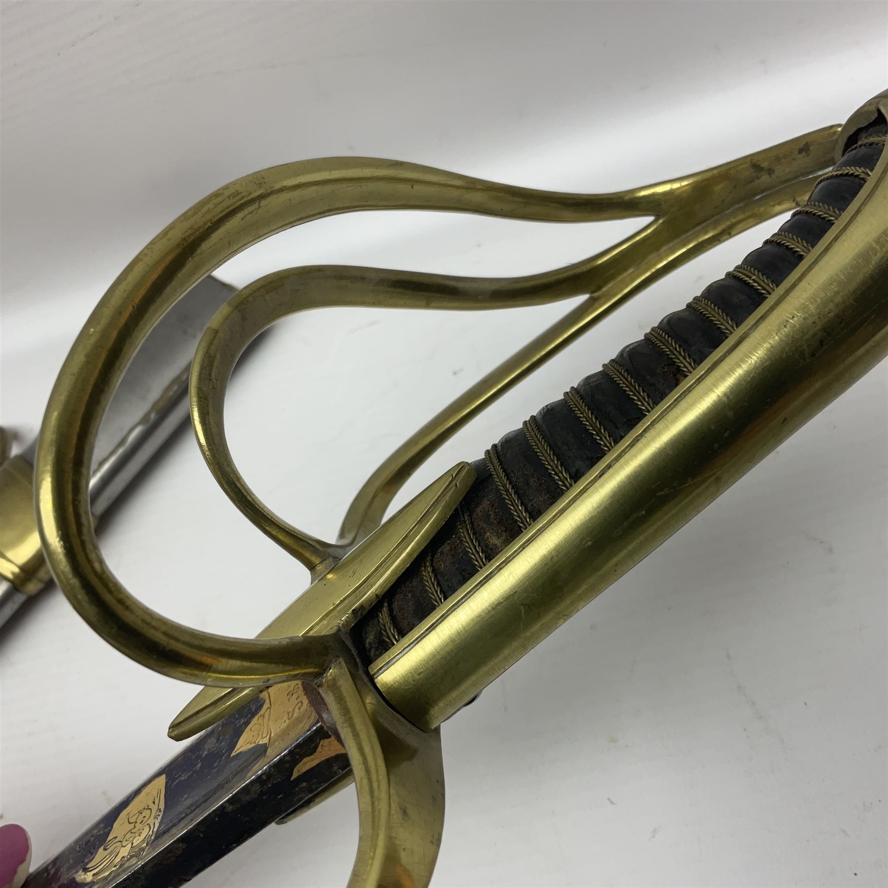 Early 19th century French Lancers officer's sword c1810, the 84cm curving fullered blade retaining most of its bluing, gilding and engraved decoration, inscribed I.S.& C. to ricasso (for Schimelbusch), brass three-bar hilt with elongated elliptical langets and wire-bound leather grip; in polished steel scabbard with two brass suspension rings L100cm overall