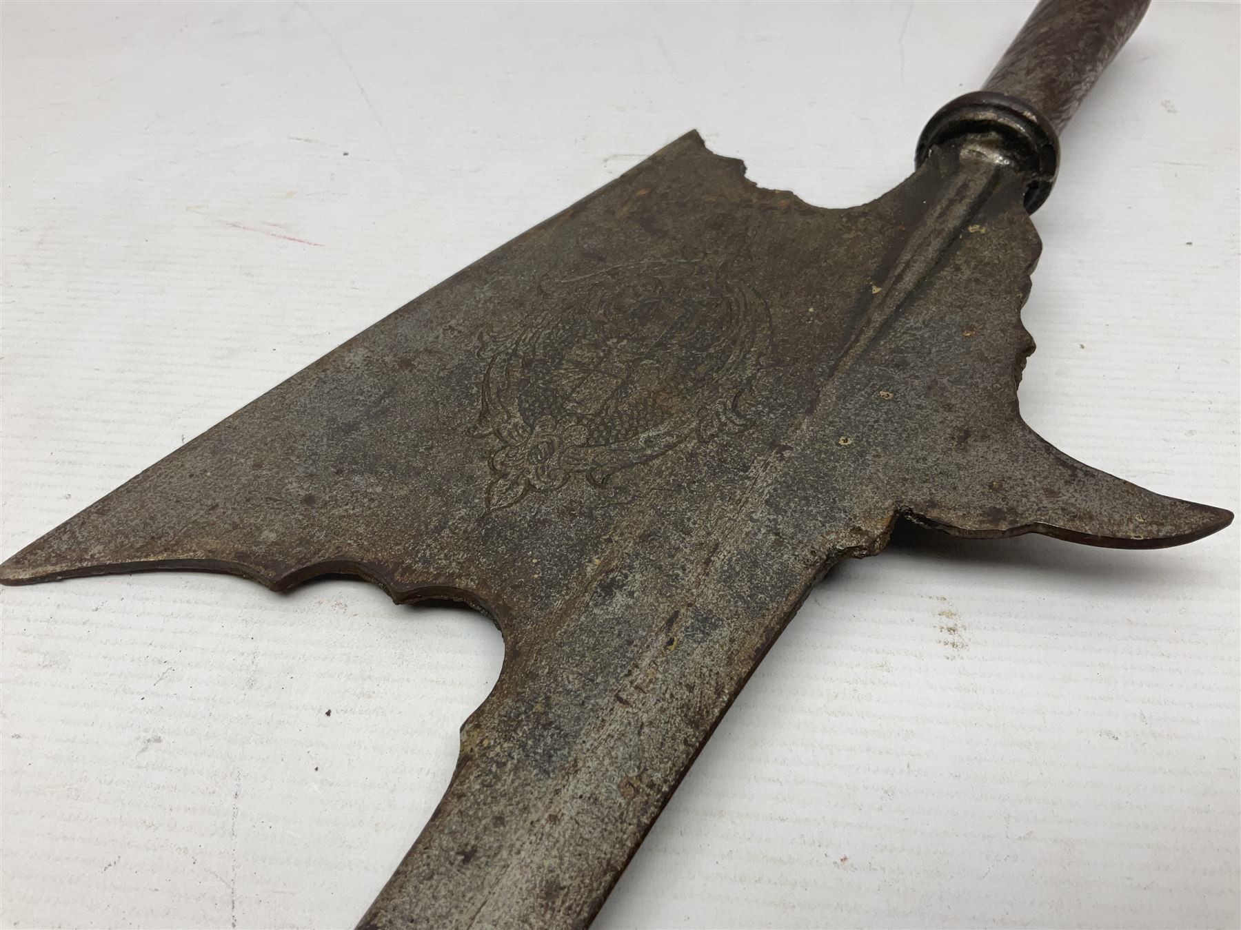 Moroccan jambiya dagger with 24.5cm plain curved blade stamped LONDON to the ricasso area, the hilt and scabbard overlaid with plain sheet brass to the back and ornate silver coloured metal to the front; waisted grip and arched pommel; two pyramid mounts to the scabbard L41cm overall; large billhook with curving blade and stacked leather washer grip; and a reproduction halberd blade (3)