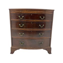 Late Georgian mahogany bow front bachelor's chest, reed moulded top over slide and four graduating drawers, lower mould, on shaped 