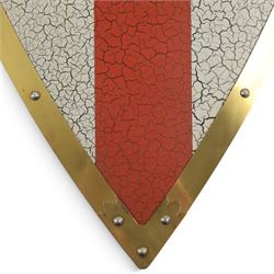 Five wall hangings, modelled as shields, decorated to the centre in relief with three lions 