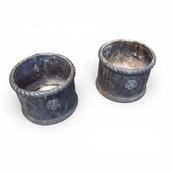 Pair of 19th century lead garden planters of cylindrical form, the rolled rope twist rims over a plain body decorated with applied flowerhead roundels, in antique weathered finish