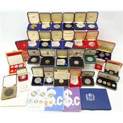  Collection of World year sets, commemorative coins, silver coins and medals including Central Bank of Jordan 1965 proof set in wooden box, Tonga 1967 year set, Singapore 1967 year set, various other year sets, Winston Churchill silver medal, Jamaica 1966 five shillings, Israel 18th Independence day silver coin, two sterling silver commemorative medals relating to cruise liners, various other commemorative medals and other coinage, many in box/case of issue  