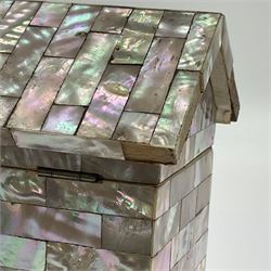 19th century French souvenir jewellery casket in the form of a bathing machine, having mother of pearl panelled tiled effect body, hinged roof/cover revealing a blue silk fitted interior with cushioned base, two silvered metal wheels, abalone shell door and mother of pearl steps, inscribed 'Berck Plage' in blue, H12cm, W13cm 