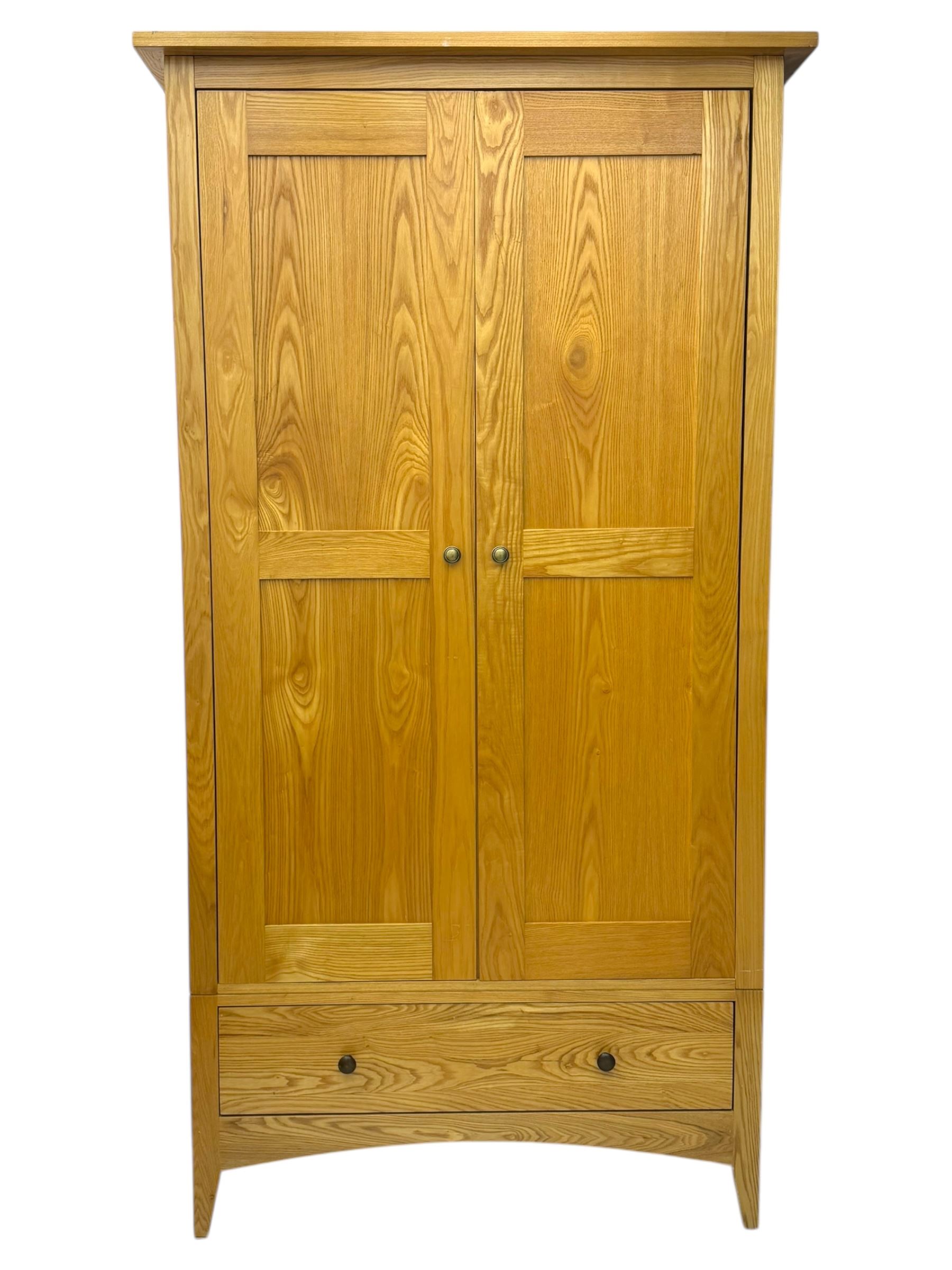Light oak wardrobe, adjustable clothes rail and single shelf above a single drawer on squared splayed legs