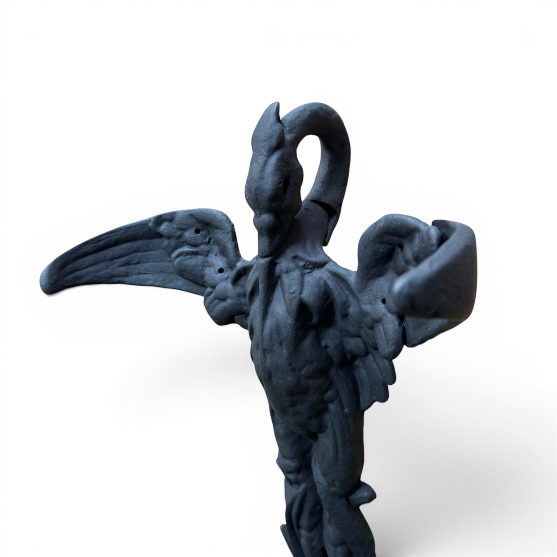 After Coalbrookdale cast iron heron stick stand, ornate detail with fish base, painted in matt black, 20th century