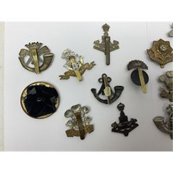 Over thirty regimental cap badges for fusiliers, Yorkshire interest, Light Infantry etc including Royal Scots and Welsh fusiliers, Durham L.I., KO Yorkshire L.I., Oxford & Bucks L.I., Green Howards, East Yorkshire, West Riding, York North Riding etc 