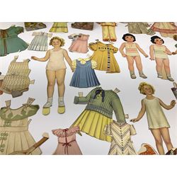 Two 37cm Shirley Temple cut-out paper and plywood dolls for dressing; and a quantity of other smaller Shirley Temple card/paper dolls with assorted clothing, one marked 'MCMXXXV E. Saalfield Pub. Co.'