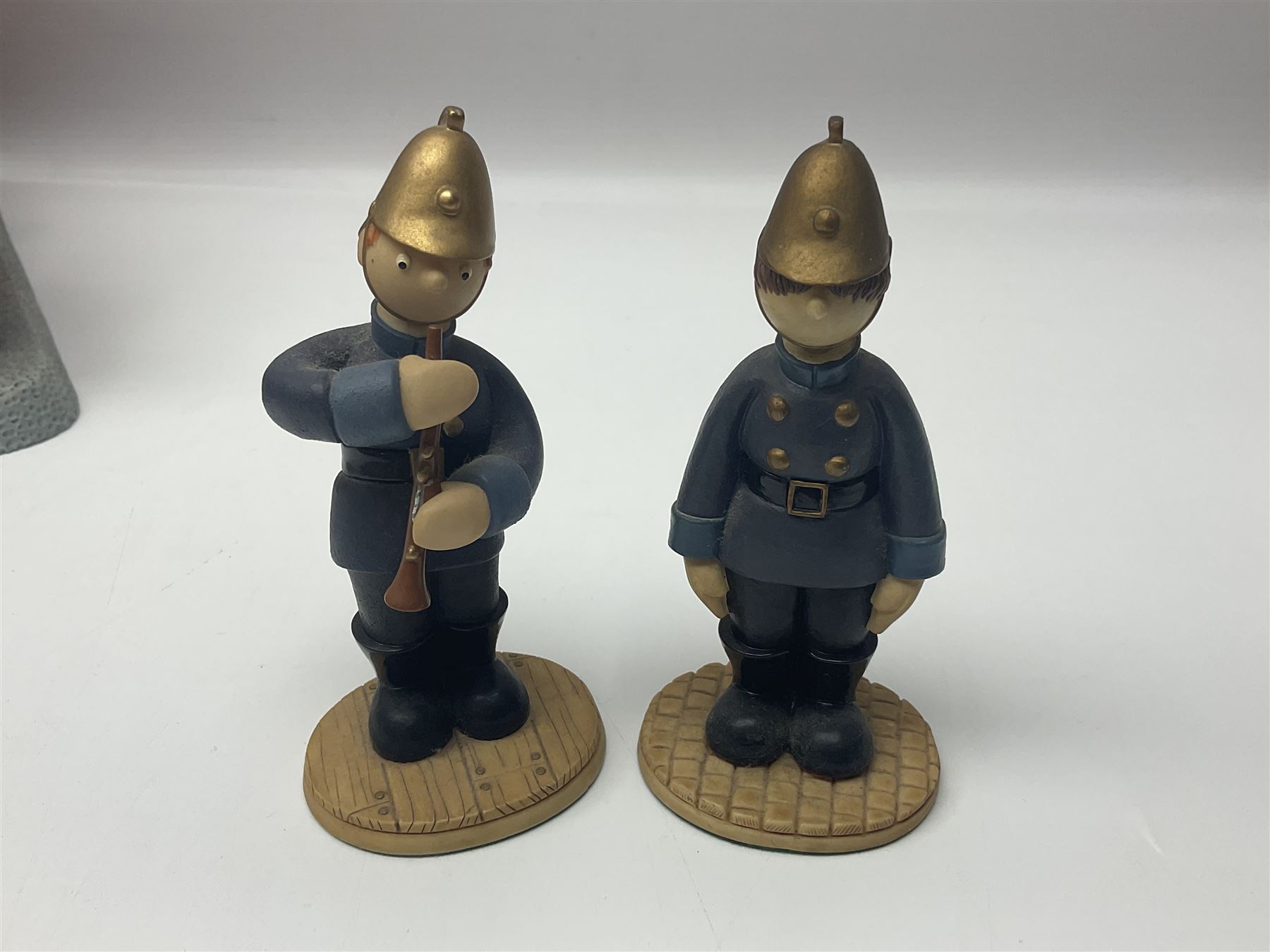 Eleven Robert Harrop figures from various collections, comprising limited edition The Trumpton Fire Engine Musical Box CGMB8 no. 359/1000, The Dragon from the Red Knight BN09, Bulldog Fireman DP165, Pointer Fire Chief DP184, Dalmatian New York Fire Fighter DP234, Dalmatian Fire Fighter DP191; Desperate Dan ‘Fireman Dan’ BDS11, Cuthbert CG13, Pugh (Clarinet) CG70, The Soup Dragon CL05 and Baby Dragon CL06