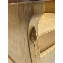 'Mouseman' oak smokers armchair, panelled sides, slung tan leather back and upholstered seat cushion, by Robert Thompson of Kilburn