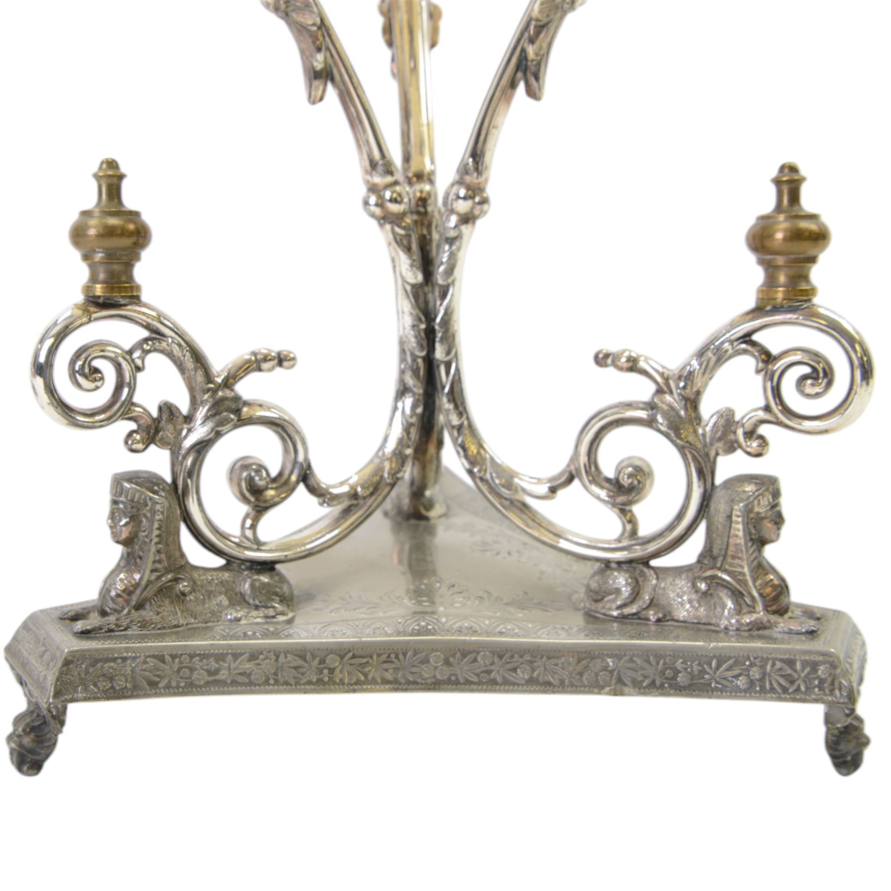 Silver plated Egyptian Revival lamp, with scrolling columns, on a trefoil base, surmounted by three sphinxes, with mask feet, H60cm