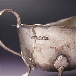 Pair of silver sauce boats with crimped rims Sheffield 1935 Maker Mappin & Webb, small embossed silver tray and two other small trays