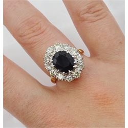 18ct gold and platinum oval sapphire and round brilliant cut diamond cluster ring, stamped, sapphire approx 2.80 carat, total diamond weight approx 1.00 carat and a 9ct gold band, hallmarked