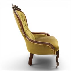 Victorian mahogany green upholstered nursing chair, balloon back with carved cresting rail, button back upholstered with low swept arms, raised on cabriole supports