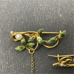 Three gold brooches, including 15ct gold pearl brooch, 9ct gold horseshoe brooch and an enamel leaf brooch