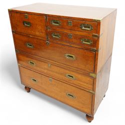Early 19th century and later teak military campaign chest, mounted and bound with brass strapping and corner brackets, fitted with one deep, two shallow and three long drawers, each with recessed brass handles and shaped escutcheons, on turned feet 