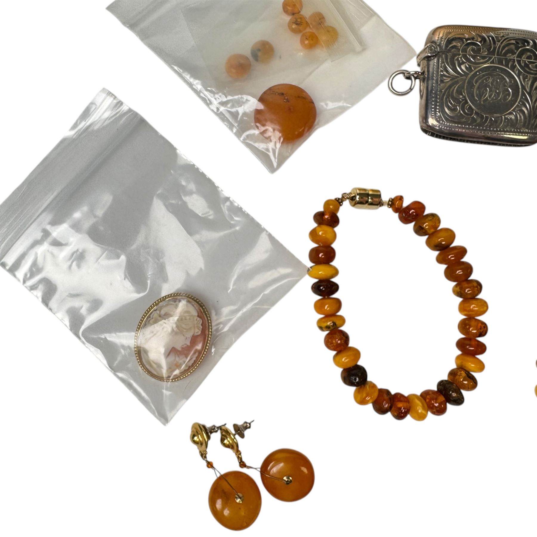 Amber type beads and earrings, silver Albert chain, silver vesta case  and a 9ct gold cameo brooch