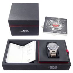 Oris TT3 gentleman's titanium automatic wristwatch, Ref. 7589, black dial with Arabic hour markers and day / date aperture, on original titanium bracelet, boxed with receipt dated 2009