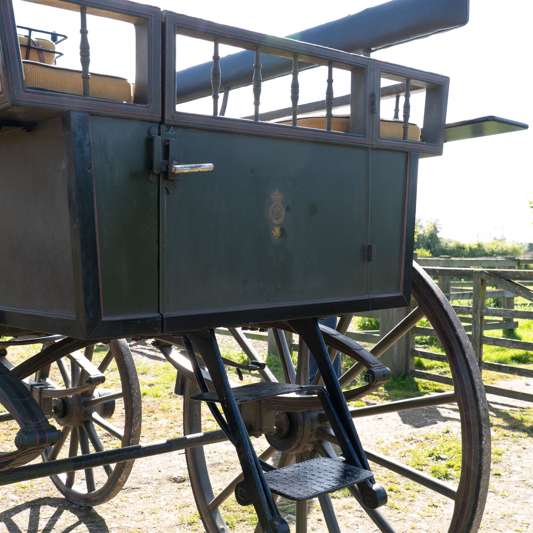The Zetland Body Break by Peters & Sons, London

A fine and substantial late nineteenth century body break by Peters & Sons of London, circa 1880, formerly owned by the Marquis of Zetland. The carriage is finished in dark olive green and black with red, black and yellow lining, and is fitted with an elevated coachman’s box seat above a forward luggage compartment. The open rear body is entered by side doors and arranged with opposing longitudinal passenger seating.

The carriage is mounted on English pattern wooden artillery wheels with iron tyres and is carried on full elliptic springs, with a transverse helper spring behind. The front axle is fitted with fifth wheel turntable steering. The rear passenger compartment has upholstered longitudinal side benches beneath padded back rails, with turned spindle upper panels to the side doors and rear handrails. The driver’s seat is upholstered in corded fabric and secured with leather retaining straps.

Details include shaped splinter bar and turntable, folding rear step below the door with leather covered interior handle, luggage rails to either side, pole fittings for use with a pair or team of horses, and a handbrake with brake blocks operating to both rear wheels. The wheel hubs are fitted with polished hub caps engraved “Peters & Sons, London”. The exterior retains small Zetland family crests to the side panels.

The carriage has been conserved by Woods of Fairbourne Carriages Ltd and is recorded as Lot 146 in The George Shaw Collection sale, 5 November 2003, where it was catalogued as The Zetland Body Break and described as having previously been owned by the Marquis of Zetland.

Features
• Peters & Sons, London coachbuilder’s hub caps
• Known as The Zetland Body Break
• Formerly owned by the Marquis of Zetland
• Circa 1880
• Conserved by Woods of Fairbourne Carriages
• Dark olive green and black bodywork with red, black and yellow lining
• Elevated coachman’s box seat
• Forward luggage compartment
• Open rear passenger body with side doors
• Opposing longitudinal passenger seating
• Turned spindle upper panels to the side doors
• Folding rear step with leather covered interior handle
• Full elliptic spring suspension with transverse helper spring behind
• Fifth wheel turntable steering
• Handbrake with brake blocks operating to both rear wheels
• Wooden artillery pattern wheels with iron tyres
• Shaped splinter bar and pole fittings for a pair or team of horses
• Small Zetland family crests to the side panels

Provenance
The George Shaw Collection, 5 November 2003, Lot 146. Previously owned by the Marquis of Zetland.

Conservation

Conserved by Woods of Fairbourne Carriages.

Dimensions:
Overall length: 310 cm
Width: 176 cm
Height: 226 cm

Front wheel diameter: 98 cm
Rear wheel diameter: 140 cm

Seating:
Driver's box seat: 2 persons

Rear passenger compartment: Two longitudinal benches accommodating approximately 8 to 10 passengers