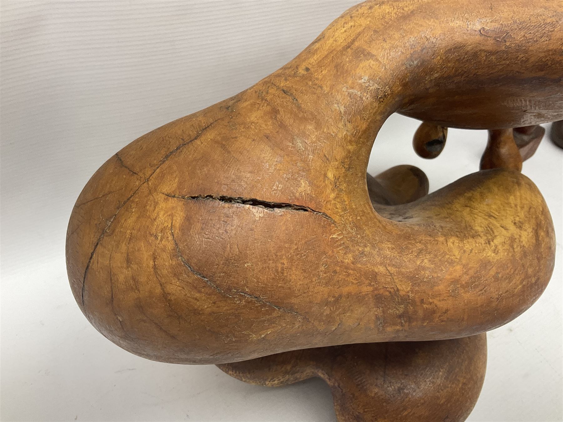 Helen Skelton (British 1933 – 2023): Three carved wooden abstract sculptures, each modelled as a a figure, tallest H52cm. Born into an RAF family in 1933 in Kent and travelled the world extensively during her childhood. After settling in Bridlington, Helen immersed herself in painting, textiles, and wood sculpture, often inspired by nature's beauty. Her talent was showcased in a one-woman show at Sewerby Hall and recognised with the sculpture prize at Ferens Art Gallery in 2000. Sadly, Helen’s daughter passed away from cancer in 2005. This loss inspired Helen to donate her sculptures to Marie Curie upon her passing in 2023.