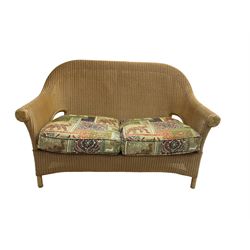 Three-piece 20th century cane conservatory suite - two seat sofa (W145cm D80cm H95cm) and pair matching armchairs (W5cm) with loose seat cushions in elephant design fabric