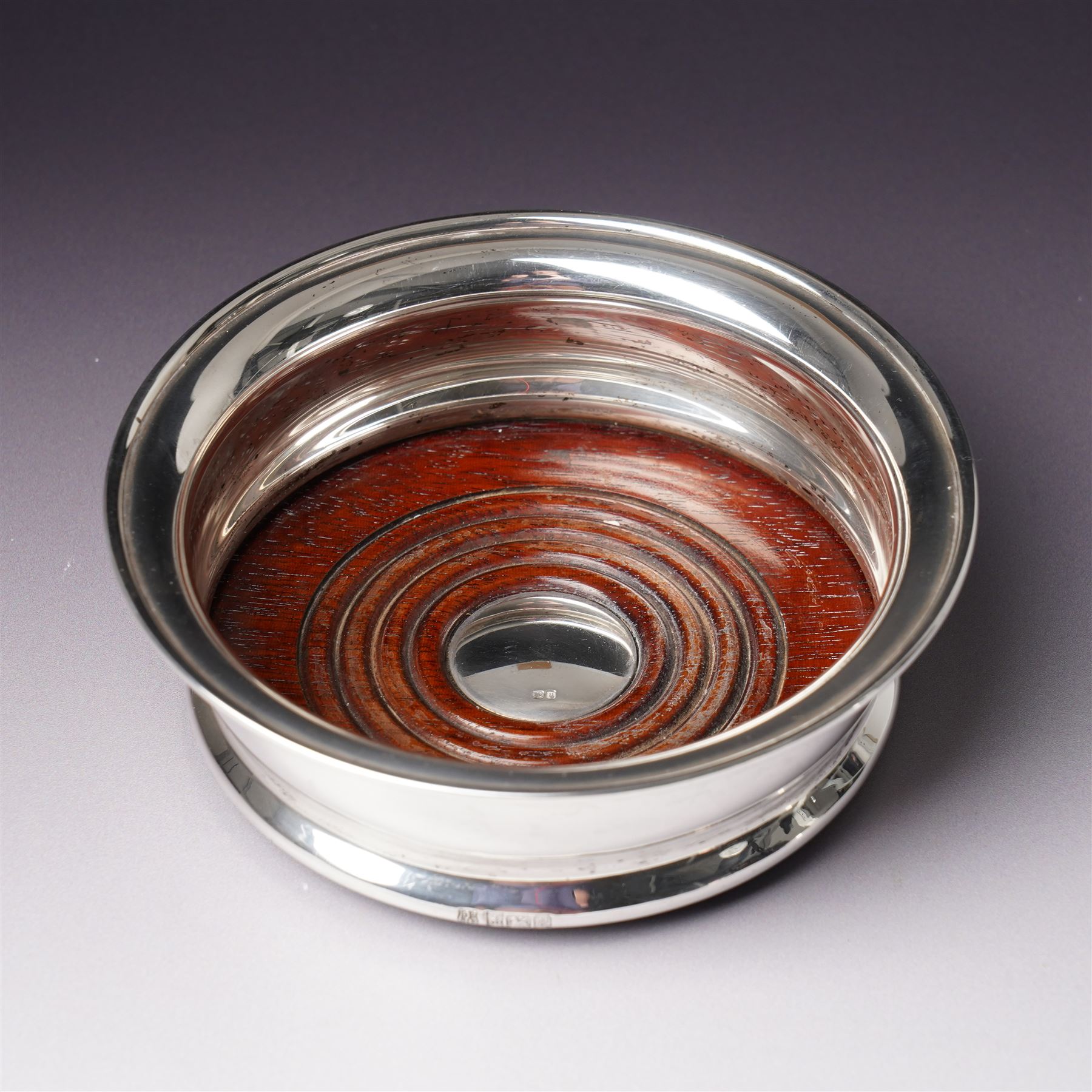 Pair of silver bottle coasters with turned wooden bases D13.5cm Birmingham 1969 Maker Barker Bros.Silver Ltd 