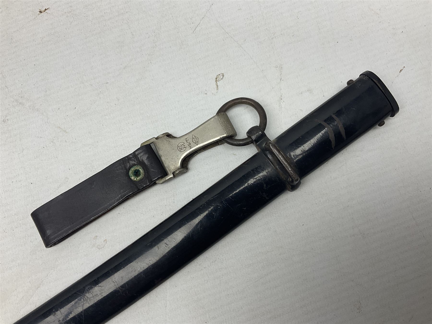 WW2 German Army Prinz Eugen Pattern Officers Dress Sword by Carl Eickhorn, the 80.5cm slightly curving fullered blade with makers name to the ricasso, gilt brass hilt with eagle to the cross-piece and relief of oakleaves to the ferrule, Prinz Eugen style down winged eagle to the pommel of the backstrap; grip retains the original wire binding; in original black painted scabbard with single hanging ring, leather hanger marked 'RZM M5/71 OLC' and silvered knot L97cm overall