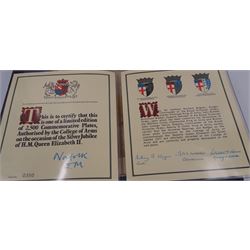 Modern limited edition silver The College of Arms plate to commemorate the The Queen's Silver Jubilee, the plain circular plate with central 24ct gold plated plaque depicting the Royal Arms, bordered by engravings of The College of Arms and the Kings Arms etc, by Danbury Mint, hallmarked Yorkshire Mint, Birmingham 1977, number 350/2500, in original fitted box with paperwork, D26,5cm, 