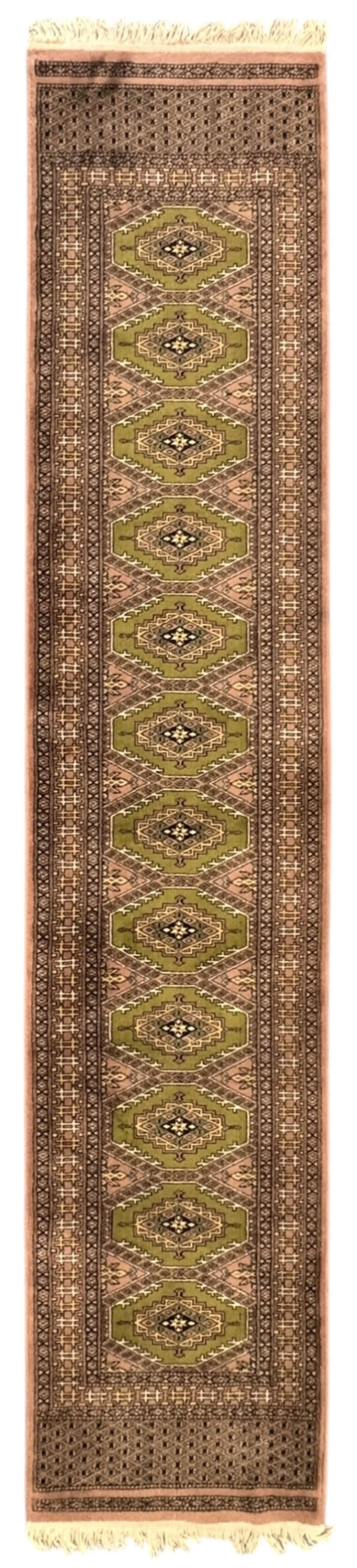 Pakistani olive and rose ground runner rug, the field decorated with repeating hexagonal medallions, surrounded by a rose-hued field with repeating diamond patterns, the borders featuring geometric motifs and trailing foliate designs