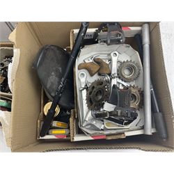 Collection of motorcycle and bicycle parts, tools and similar equipment, to include seats, lights, pedals, brakes and two drill stands, etc, in three boxes 