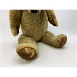 Very large Irish Tara bear c1950s with plush covered body, swivel jointed head with glass eyes and vertically stitched nose and mouth, jointed limbs with rexine pads and growler mechanism H37