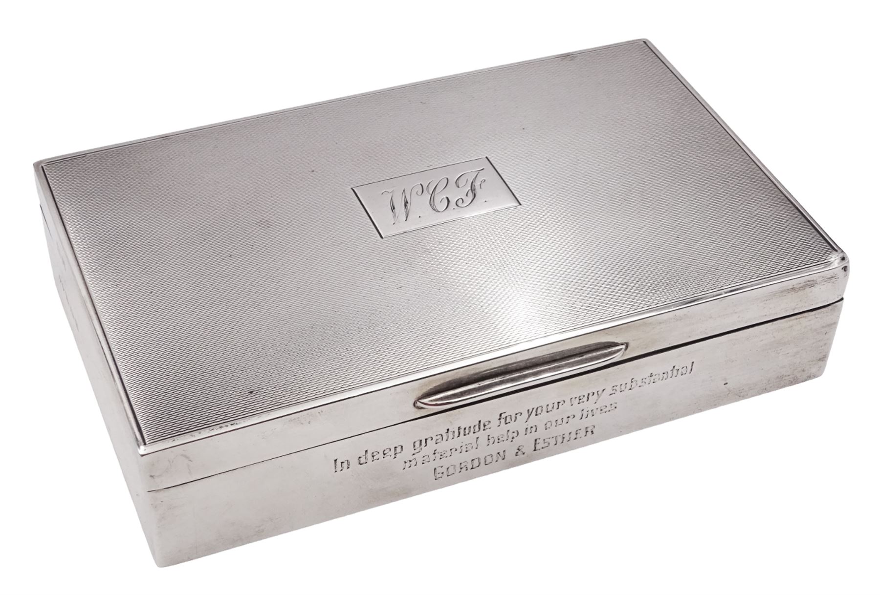 Modern silver mounted cigarette box, of rectangular form, with personal enraving to front and engine turned decoration and initials to cover, opening to reveal soft wood lined partitioned interior, hallmarked Frederick Field Ltd, Birmingham 1962