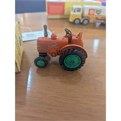 Three Dinky Toys diecast vehicles, comprising Field Marshall Tractor no. 301, Shell BP Fuel Tanker no. 944 and Snow Plough no. 958, all boxed