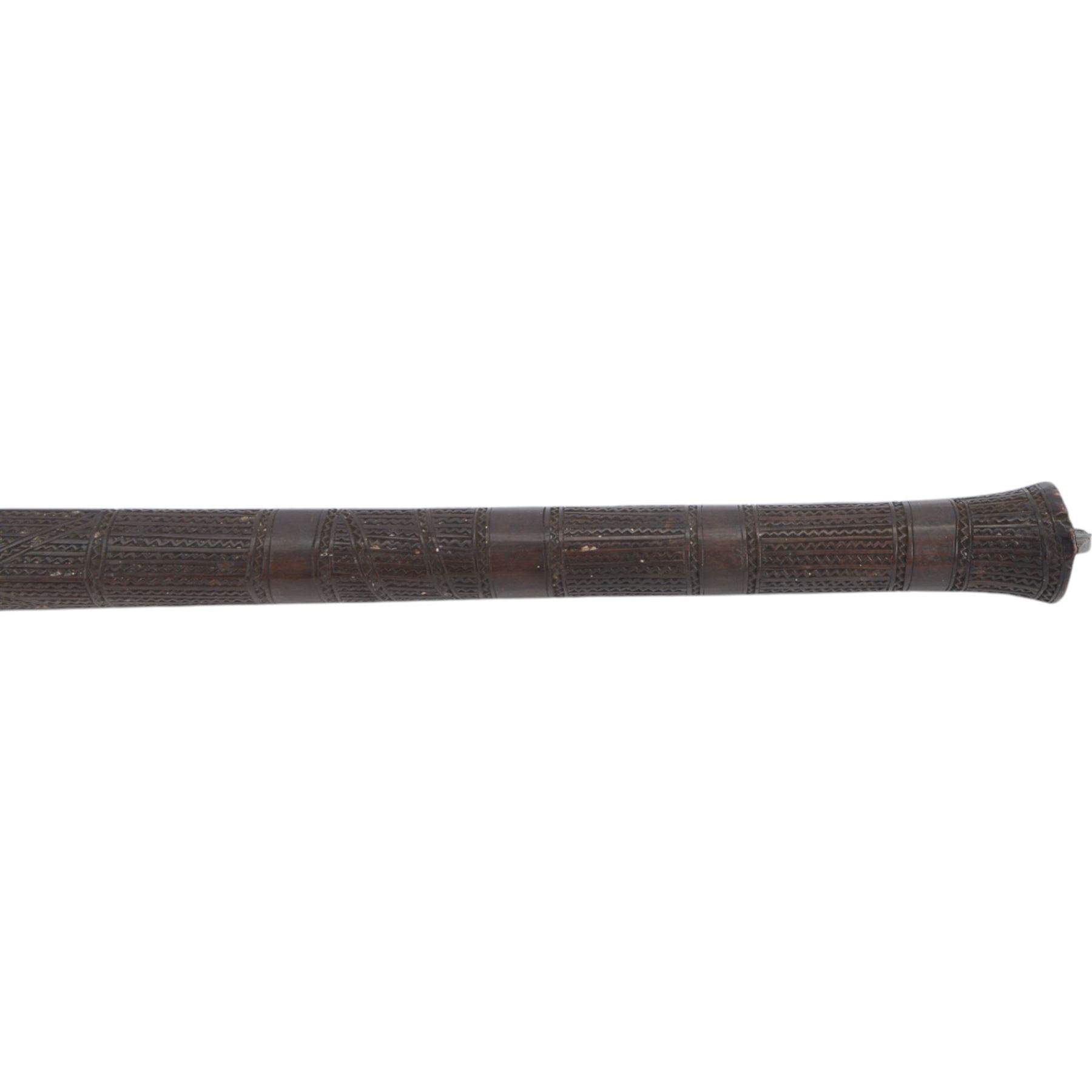 Polynesian war club, of dense hardwood, the tapering diamond shaped head carved with panels of geometric bands, L78cm