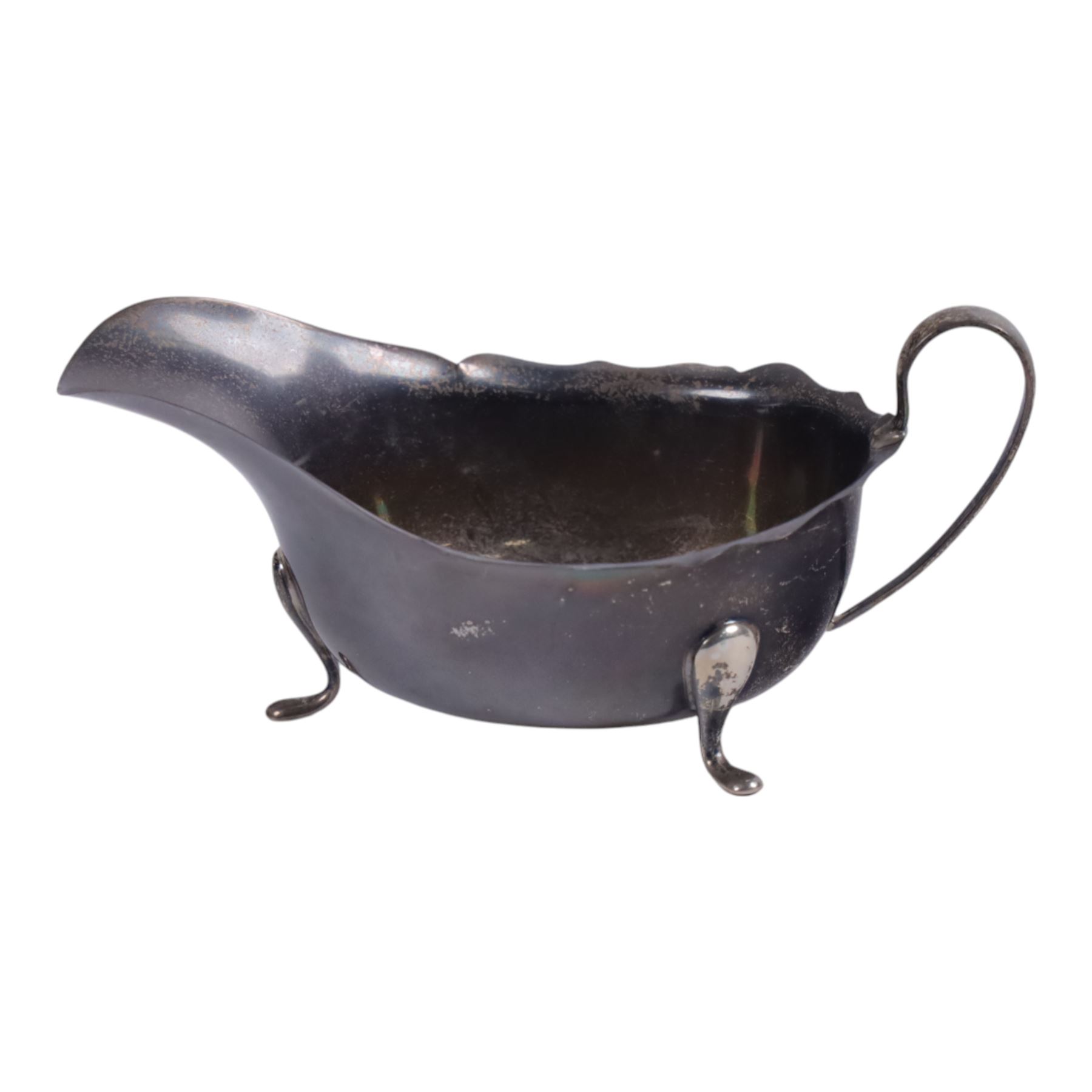 Group of silver, comprising 1930s silver five bar toast rack, 1940s silver sauce boat, three pairs of napkin rings and a single pierced foliate napkin ring, all with vacant cartouches, all hallmarked 