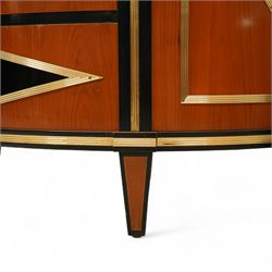 Colombo Mobili - Pair of Italian designer cherrywood art-deco inspired demi-lune commode cabinets, the shaped top with ebonised inlay and gilt brass repeating anthemion beading above a gilt brass reeded moulding, over three long drawers with gilt brass geometric panel mounts, flanked by cupboard doors with diamond motif, raised on tapering square supports 