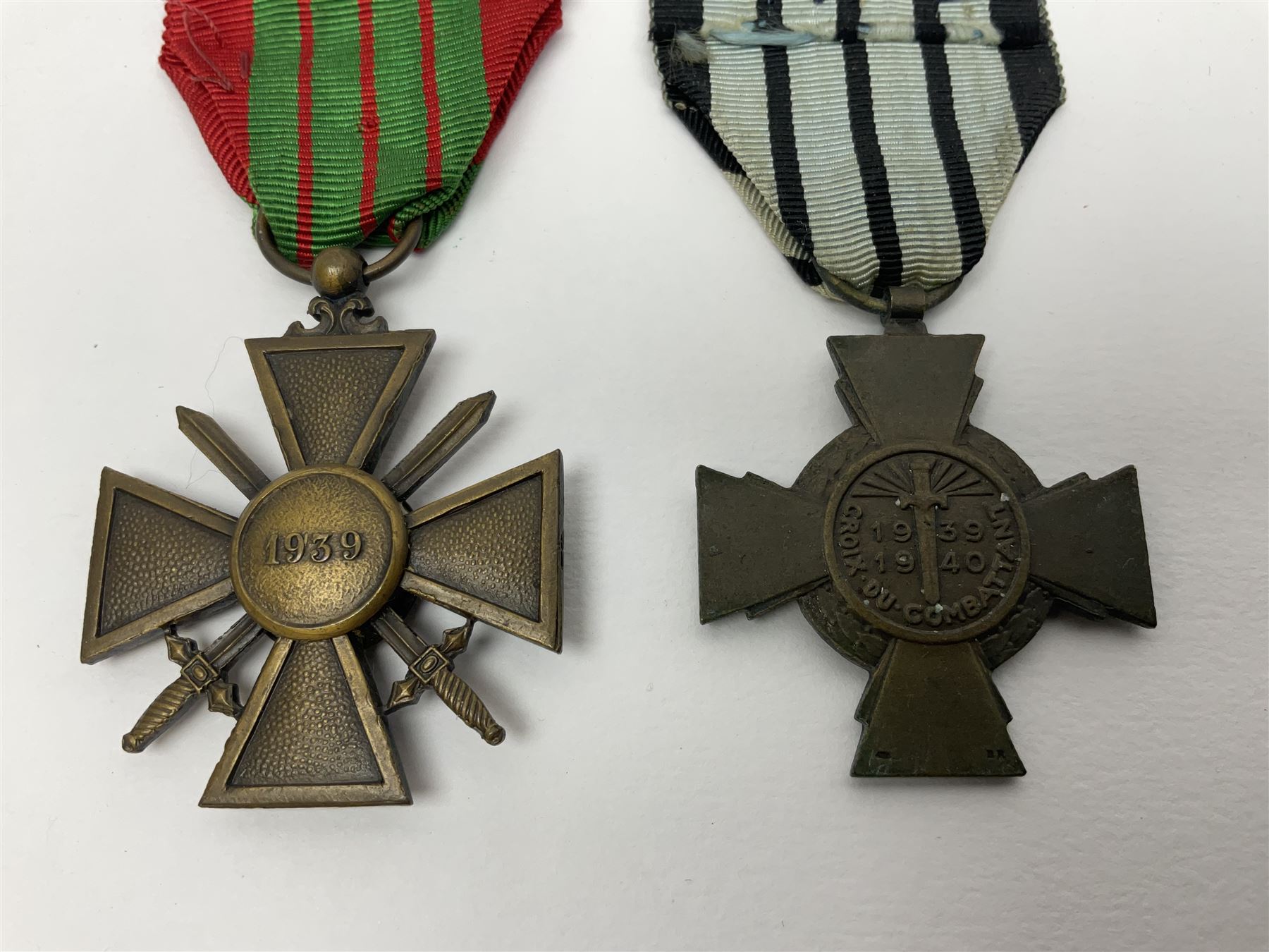 Four French medals - St. Helena medal with bust of Napoleon to obverse and inscription to reverse 'Campagnes de 1792 a 1815. A ses compagnons de gloire sa derniere pensée Ste. Hélène 5 Mai 1821', established by Emperor Napoleon III in 1857; two WW2 Croix-de-Guerre; and WW2 Croix-du-Combattant; all with ribbons (4)