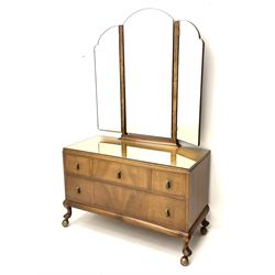 Waring and Gillow - early to mid 20th century figured walnut dressing chest, triple shaped mirror back, fitted with four drawers, cabriole supports with castors, labelled  