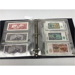 World banknotes, including Queen Elizabeth II The States of Jersey one pound 'DB202703', five pounds 'BB527762' and ten pounds 'AB651481', reserve bank of New Zealand two dollars '1L3 741894', King George V Straits Settlements one dollar 1st January 1935 'F/83 28924', various Bank of England notes etc, housed in two ring binder albums